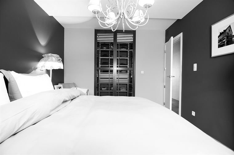 A restful bedroom with layered light